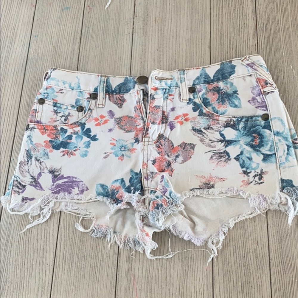 Free people floral Jean cutoff shorts.